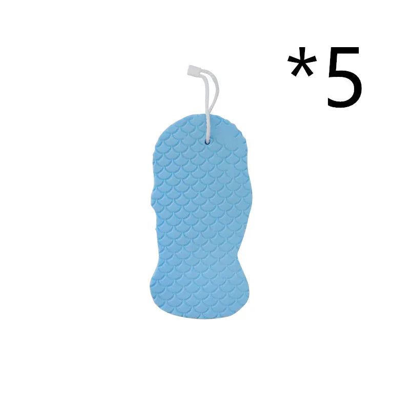 White 3D fish scale pattern bath sponge ball with hanging loop on a grey background.