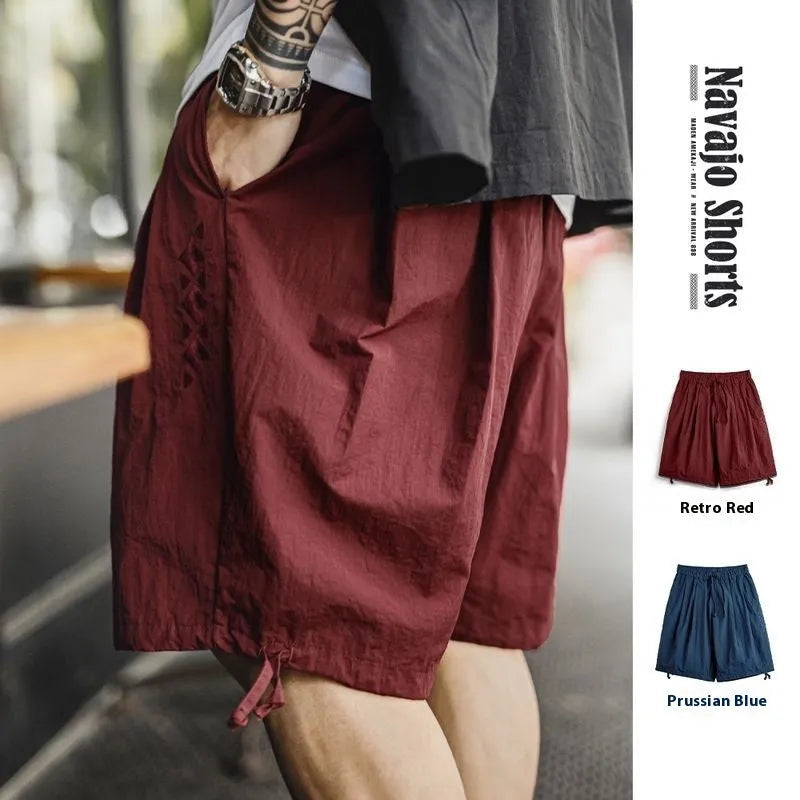 Men's Prussian blue embroidered nylon beach shorts with elastic waistband