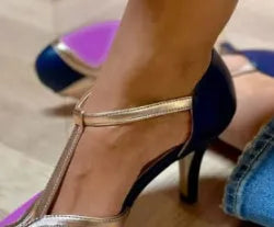 Women's blue and pink round toe stiletto high heel pump with button fastening.
