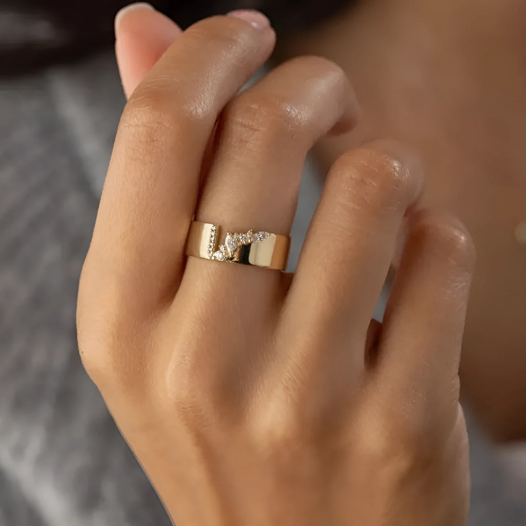 Gold electroplated women's ring with zircon detailing on a copper base, shown in size 8.