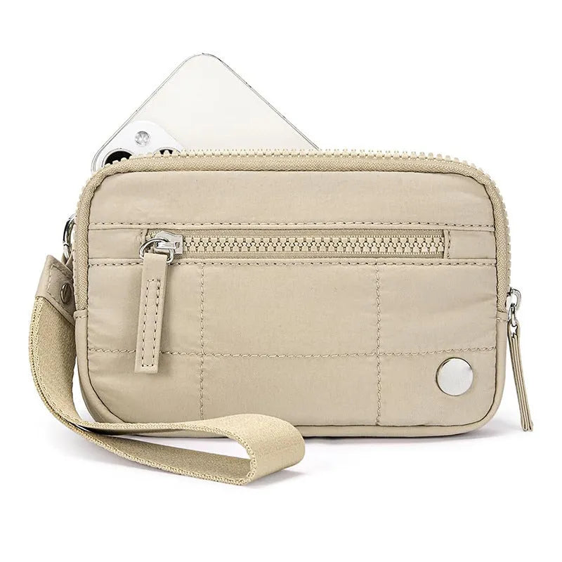 Women's waterproof quilted nylon handbag with transparent deck in beige colour