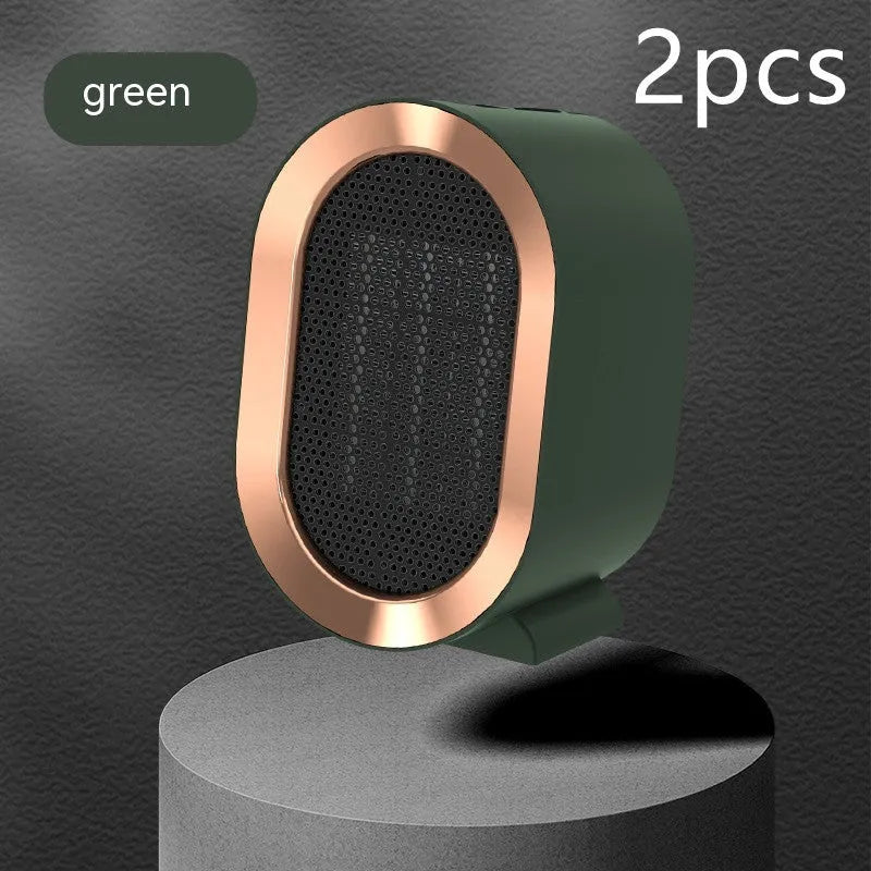 Compact desktop electric fan heater in black with mechanical control dial.