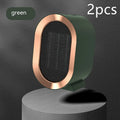 Compact desktop electric fan heater in black with mechanical control dial.