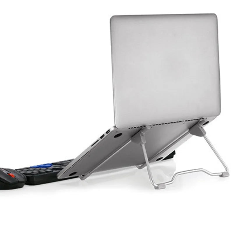Grey aluminium alloy and plastic mobile phone stand laptop stand on a desk