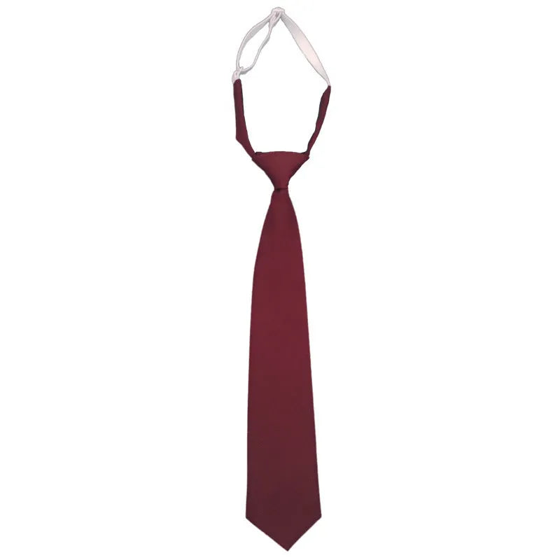 Solid colour men's cotton bow tie in arrow style laid flat, showing navy blue colour option.