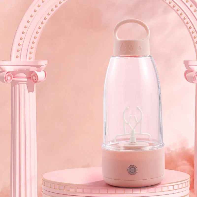 Automatic electric shaker bottle with USB port, handle, and blending motor in green, pink or white.