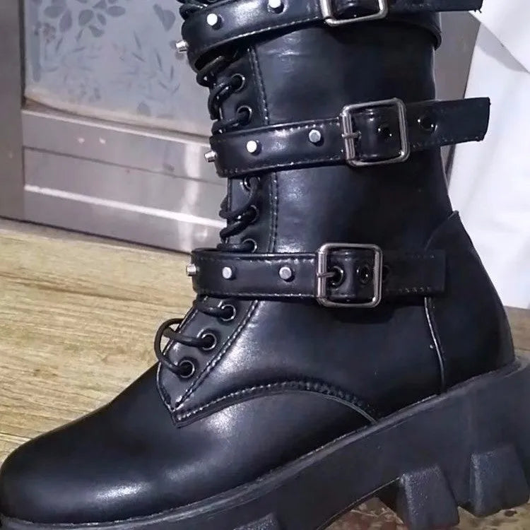 Black women's mid-calf knight boots with metal buckle straps and a side zipper on a round toe.
