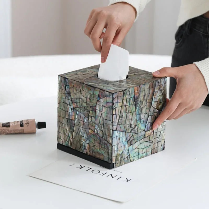 Black square and rectangular natural shell tissue boxes with removable storage organisers.