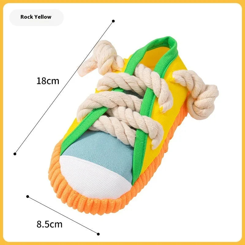 Slipper-shaped plastic dog chew toy with squeaker in three colour options