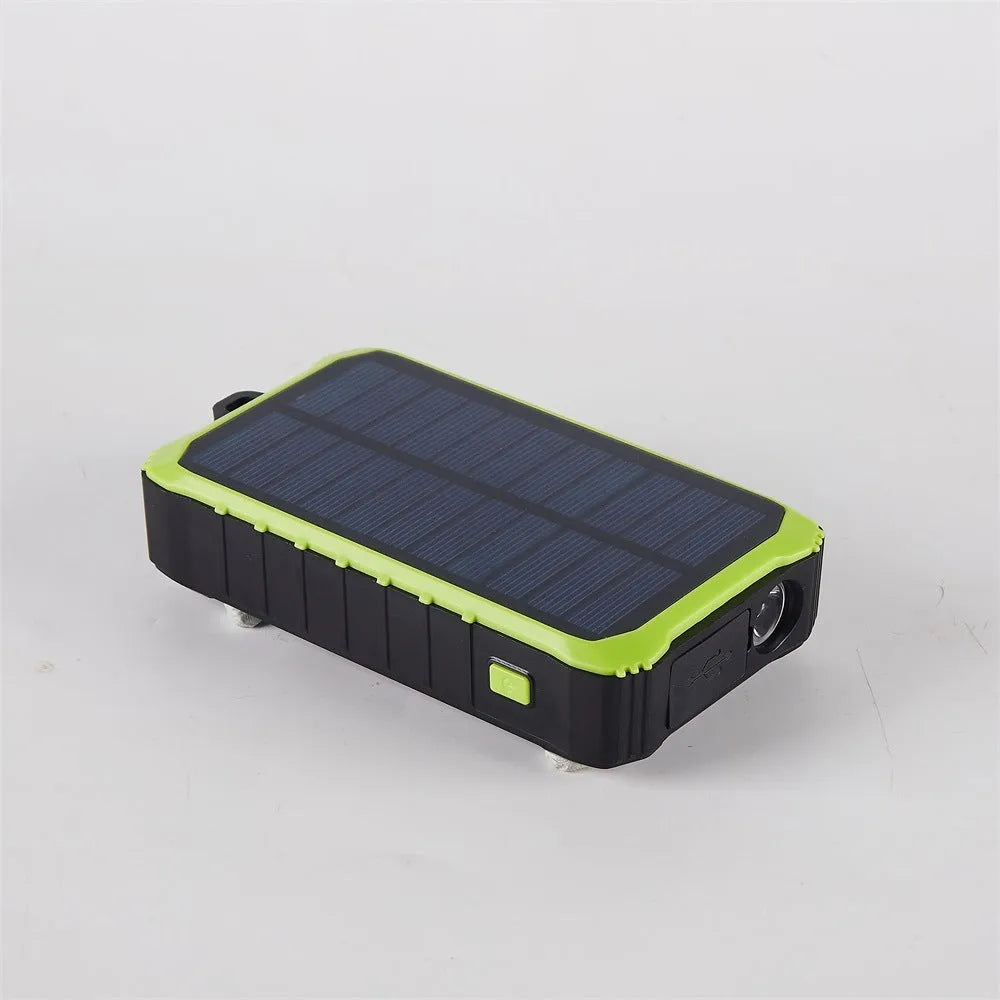 Orange and green solar hand power bank with 12000mAh capacity showing dual USB ports and hand crank