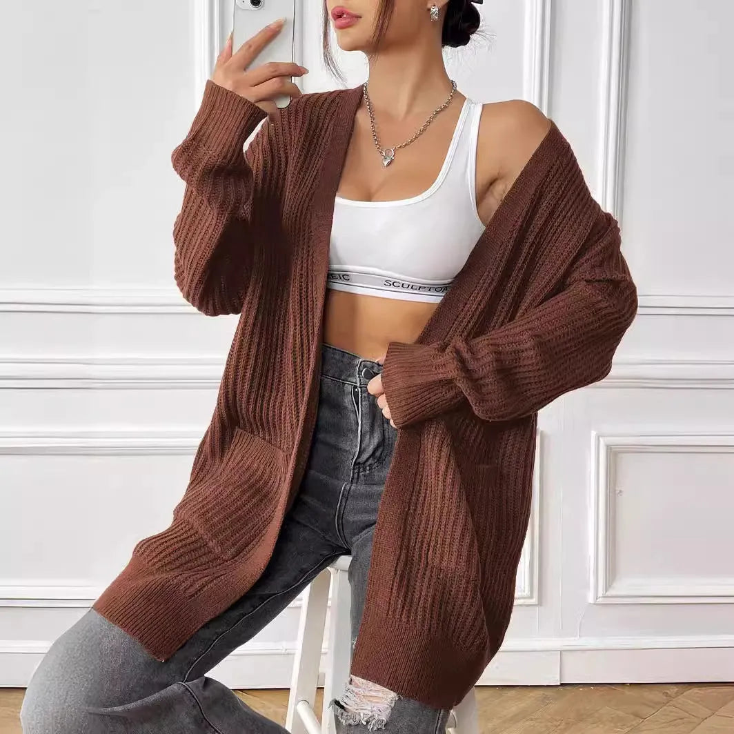 Womens double pocket acrylic cardigan in dark green colour showing mid-length design and loose fit