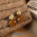 Handmade alloy geometric ear rings with electroplating in Maillard Amber and Tigereye styles featuring tassel details