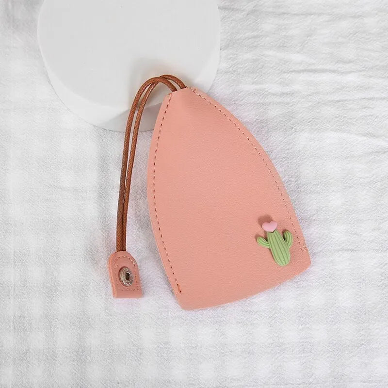 Cartoon PU leather pull-out car key case measuring 14 x 7.5cm with colourful designs