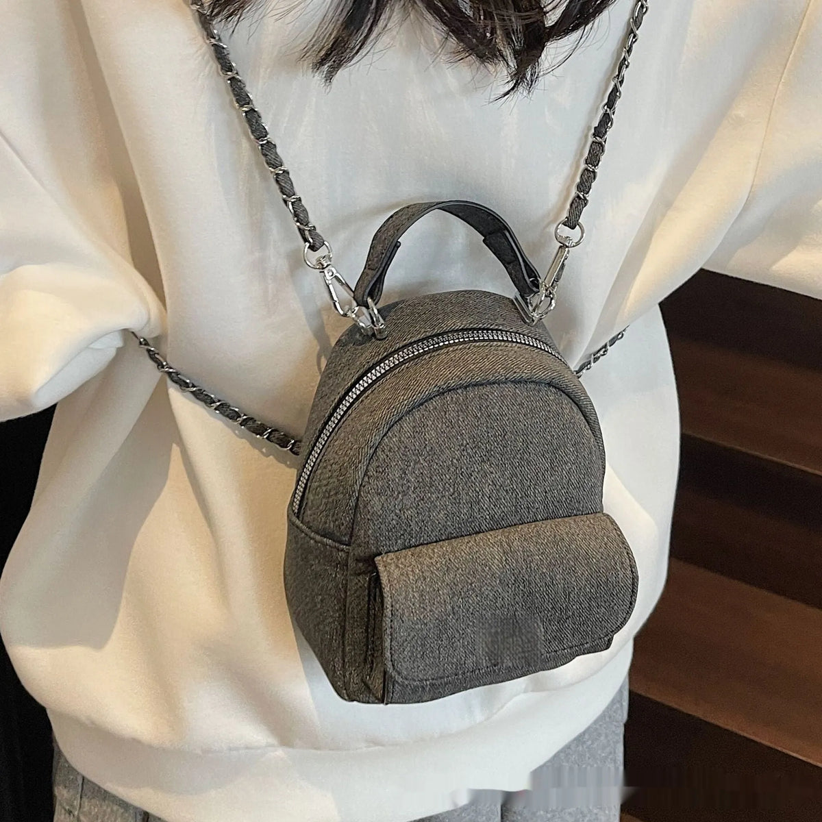Korean style solid colour PU backpack with three-dimensional pocket, available in black, beige, blue, dark blue and khaki.