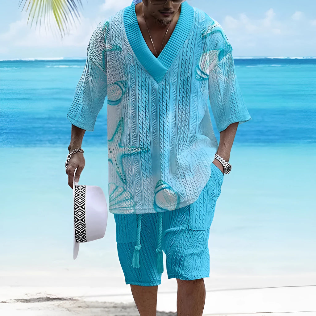 Man wearing a loose-fitting short-sleeve top and matching casual shorts in a solid colour.