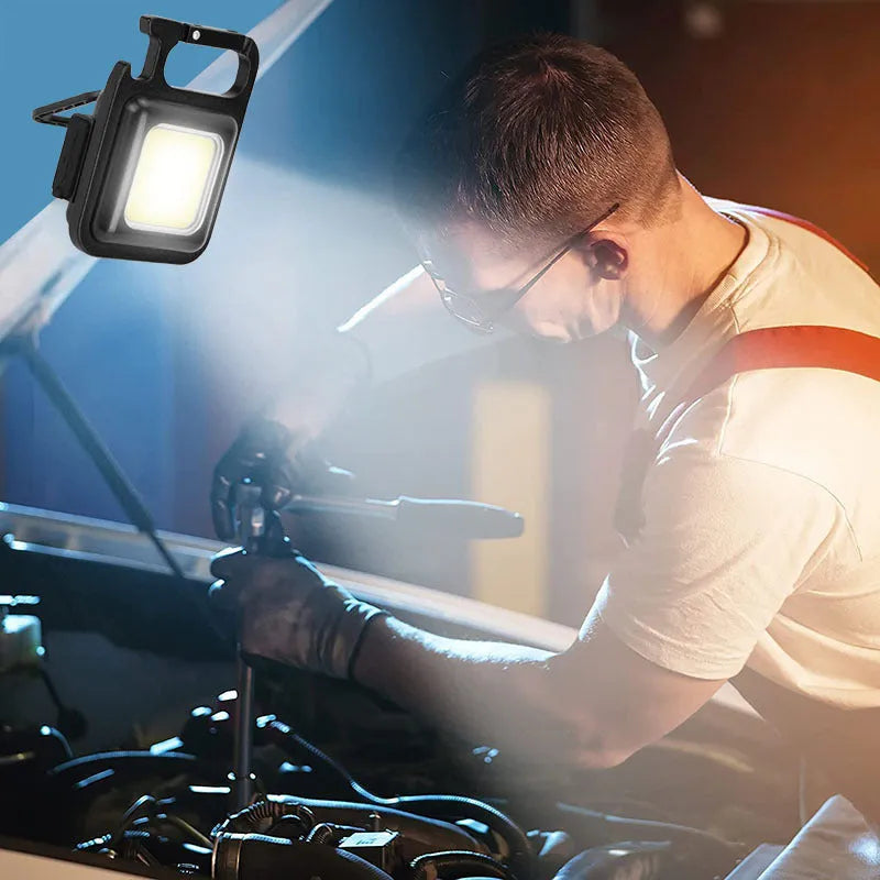 Black aluminium alloy USB rechargeable keychain flashlight with magnetic base and folded swivel handle