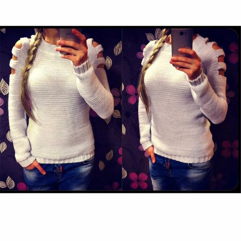 Women's grey hollow out knitted pullover top with round neck and long sleeves laid flat.