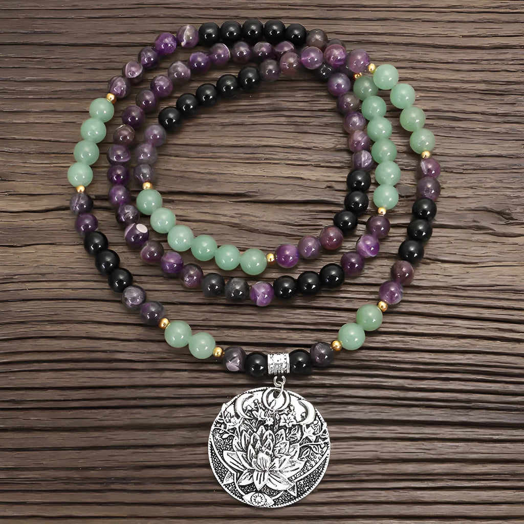 Geometric lotus pendant yoga necklace with stone bead chain and matching bracelet on white background