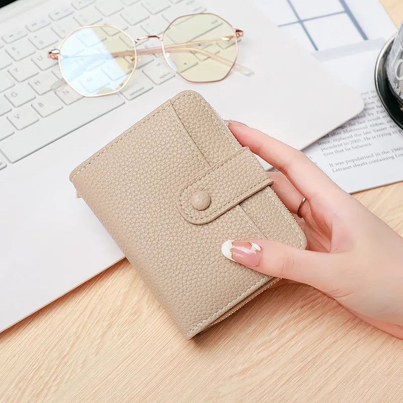 Ladies' short wallet with lychee pattern in PU leather showing 2-fold design in beige colour