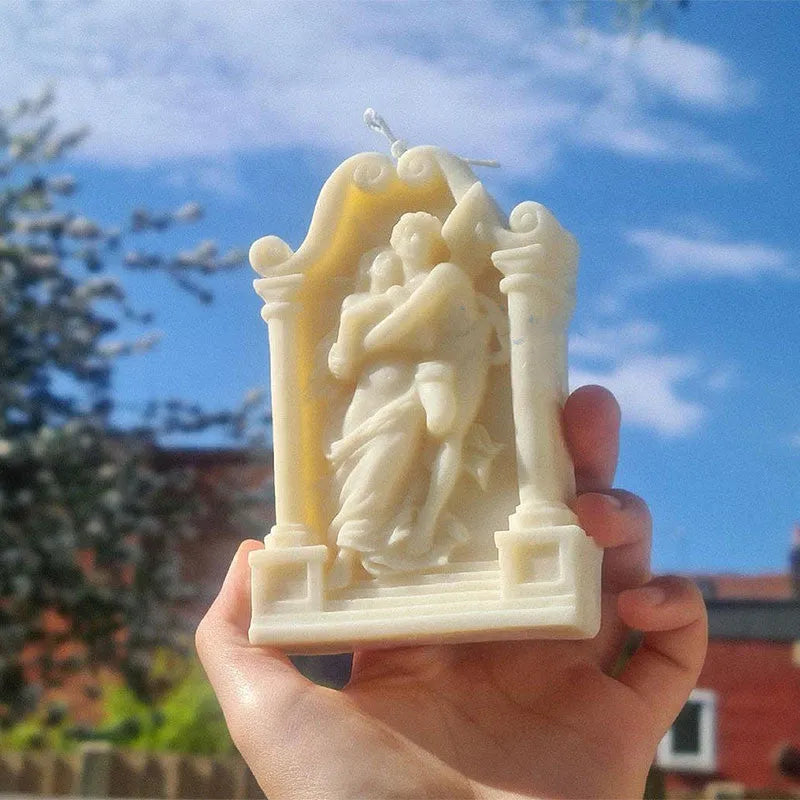 Flexible food grade silicone mold showing detailed Ancient Greek-style couple angel design for baking and crafts.
