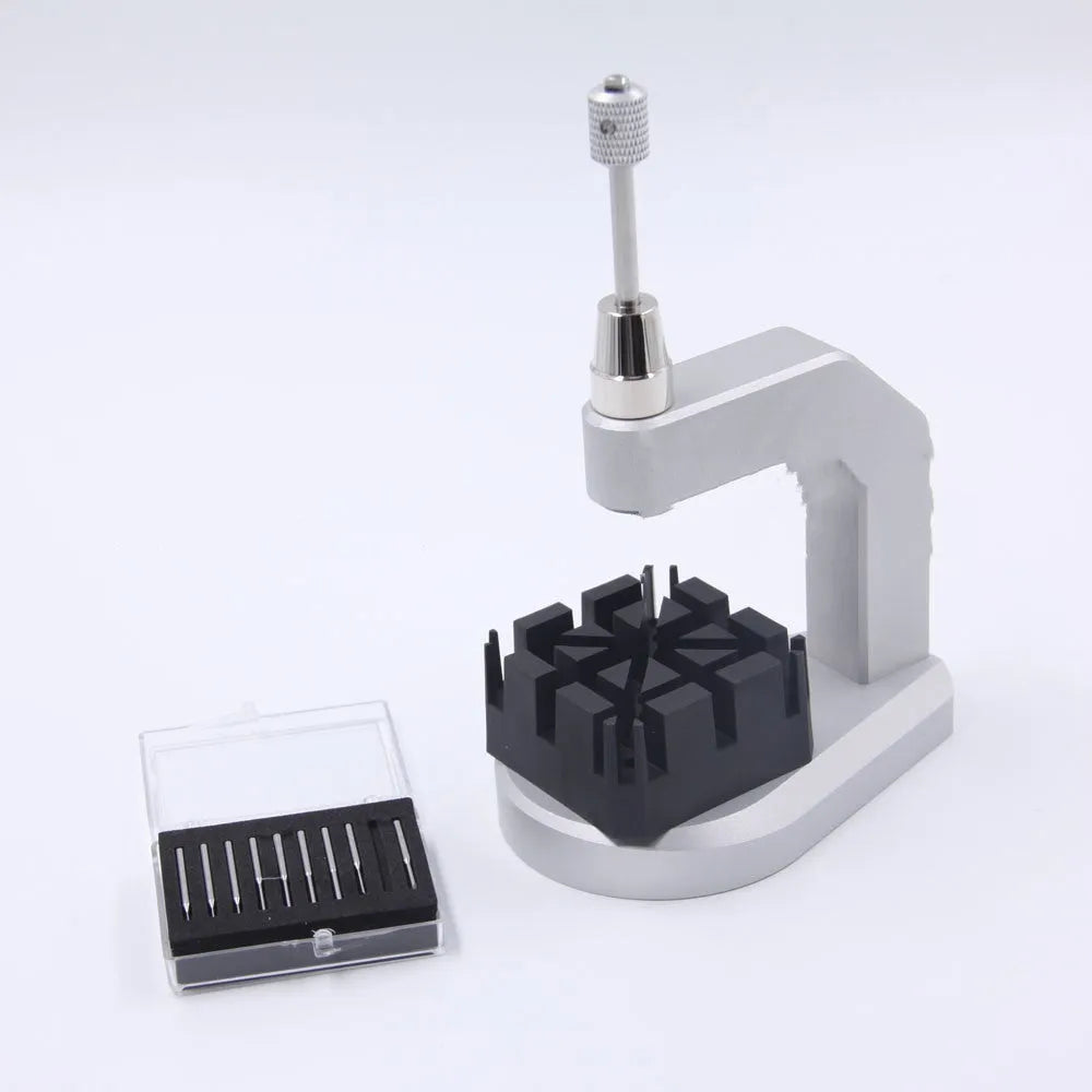 Silver-coloured press strap removal tool made from tool steel for watch and electronics repair.