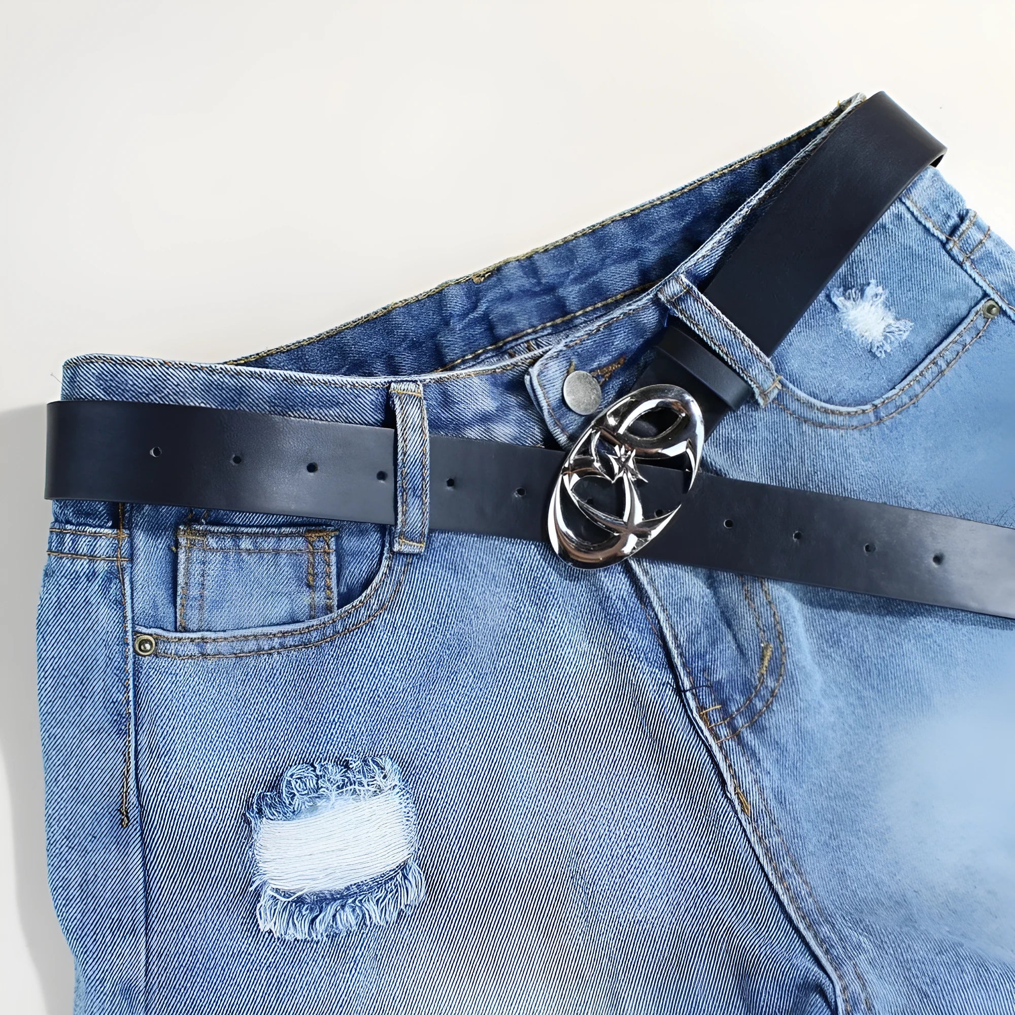 Casual silver buckle belt with PU leather strap showing snap button closure.