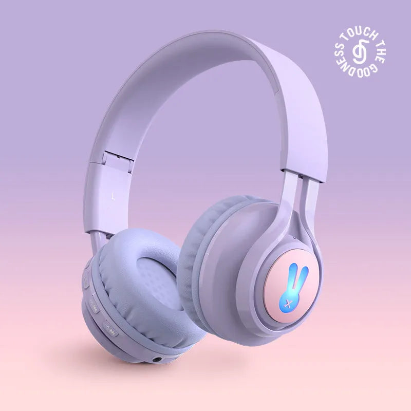 Children's wireless headphones with RGB lights in bunny pink colour showing power display and microphone