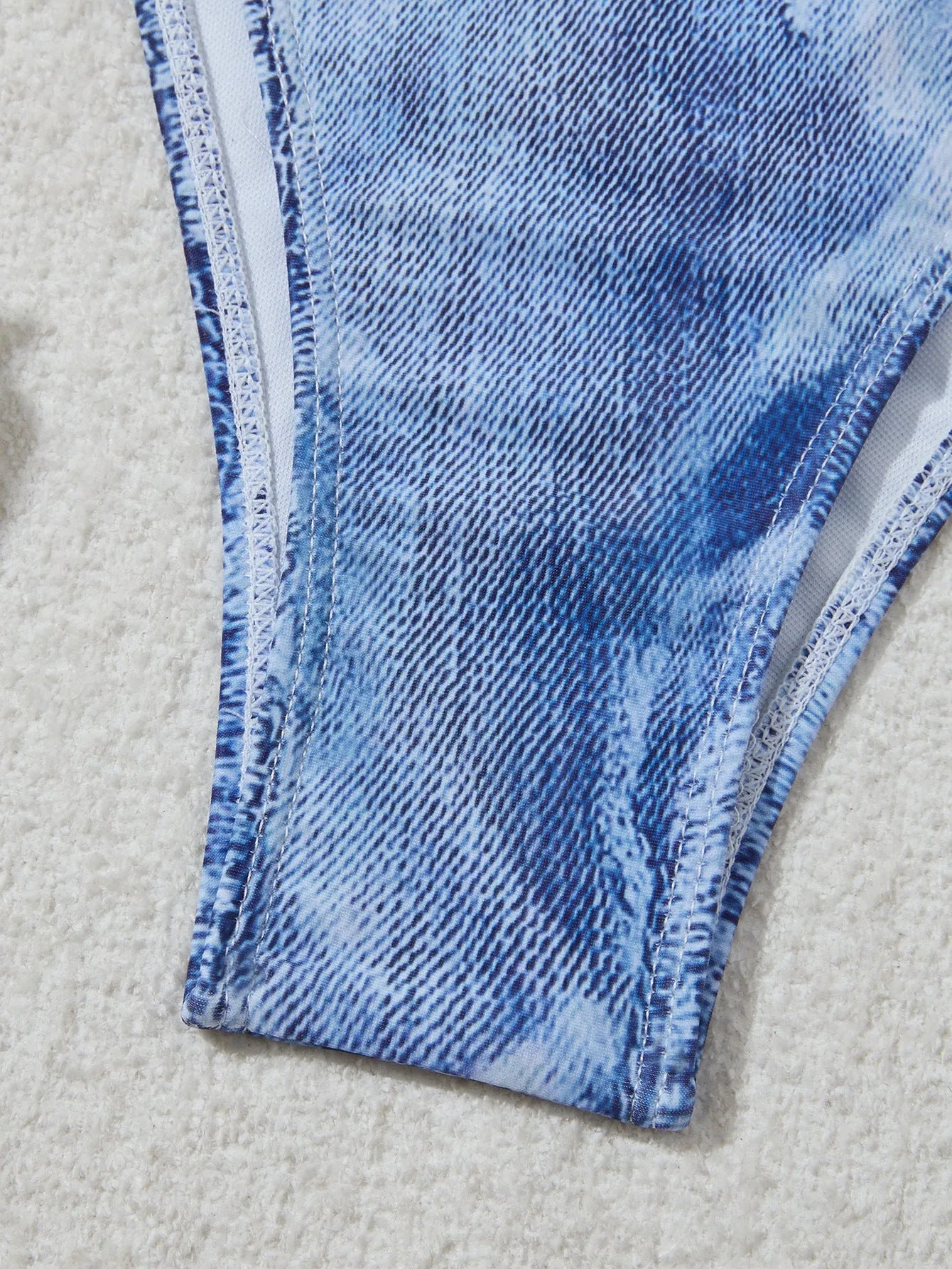 Women's denim blue printed strap bikini set on white background