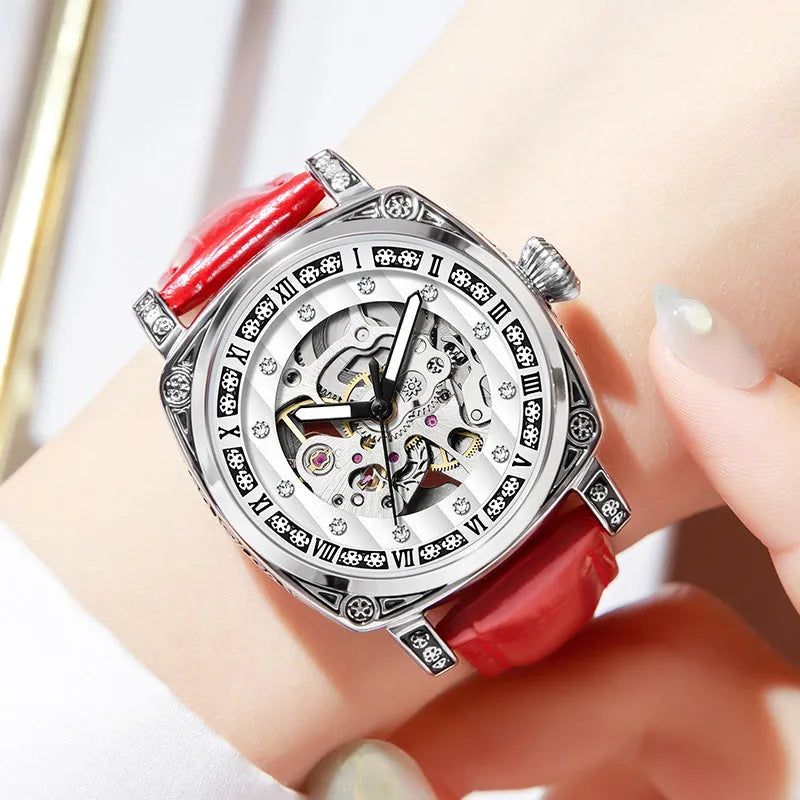 Leather strap mechanical watch with luminous hands showing 10 metre water resistance rating.