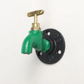 Metal water pipe style towel hook mounted on a wall in black, green, or red.