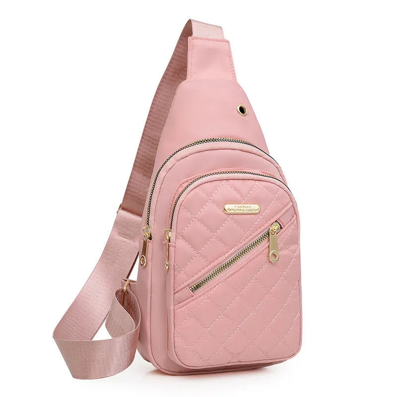 A girl's crossbody sports chest bag in Oxford cloth, shown in a choice of colours including black, dark blue, red, purple, and pink.