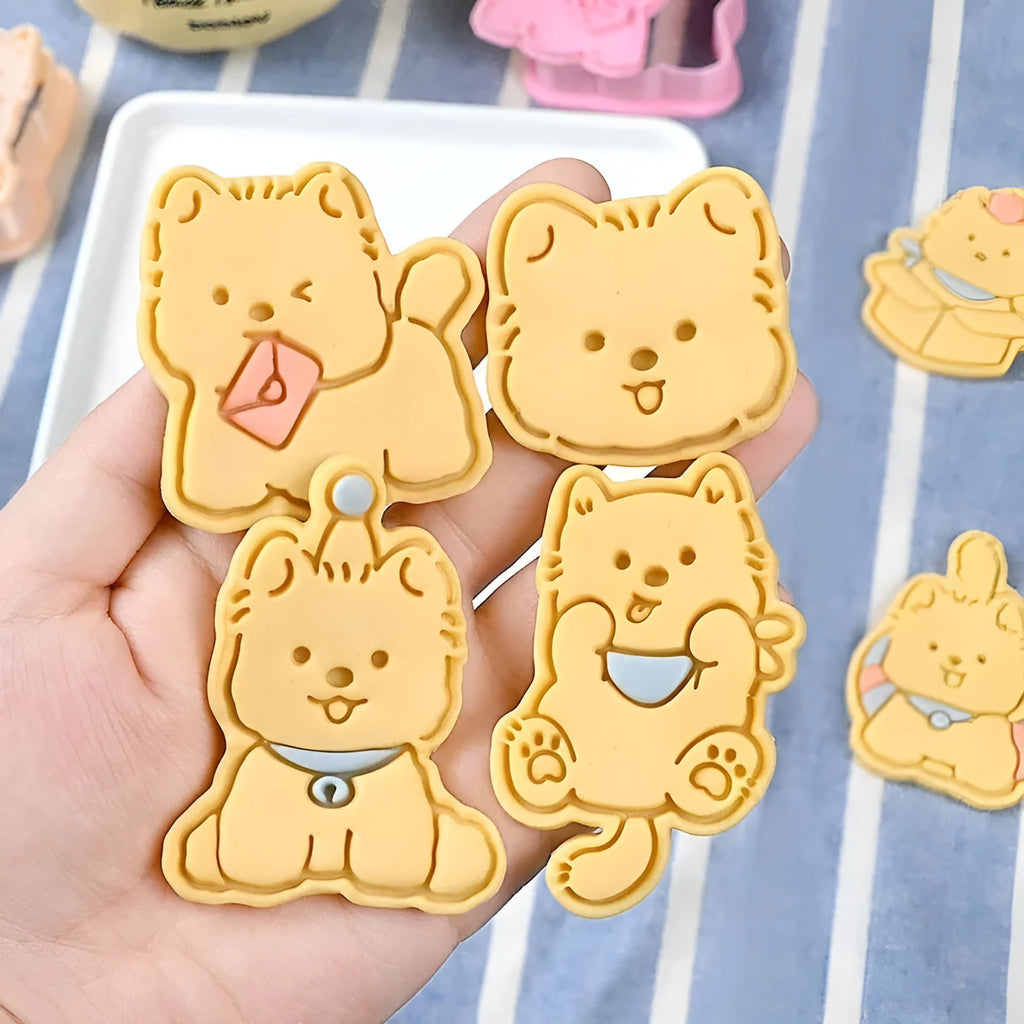 Plastic 3D biscuit mould with cartoon puppy designs including birthday hats and swimming rings