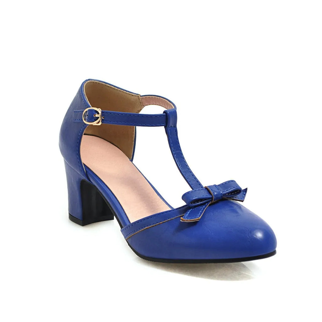 Women's apricot coloured sandals with a chunky 6.5cm heel, bow tie decoration, and a single buckle strap.