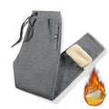 Men's grey fleece-lined cotton track pants with drawstring waistband in oversized fit