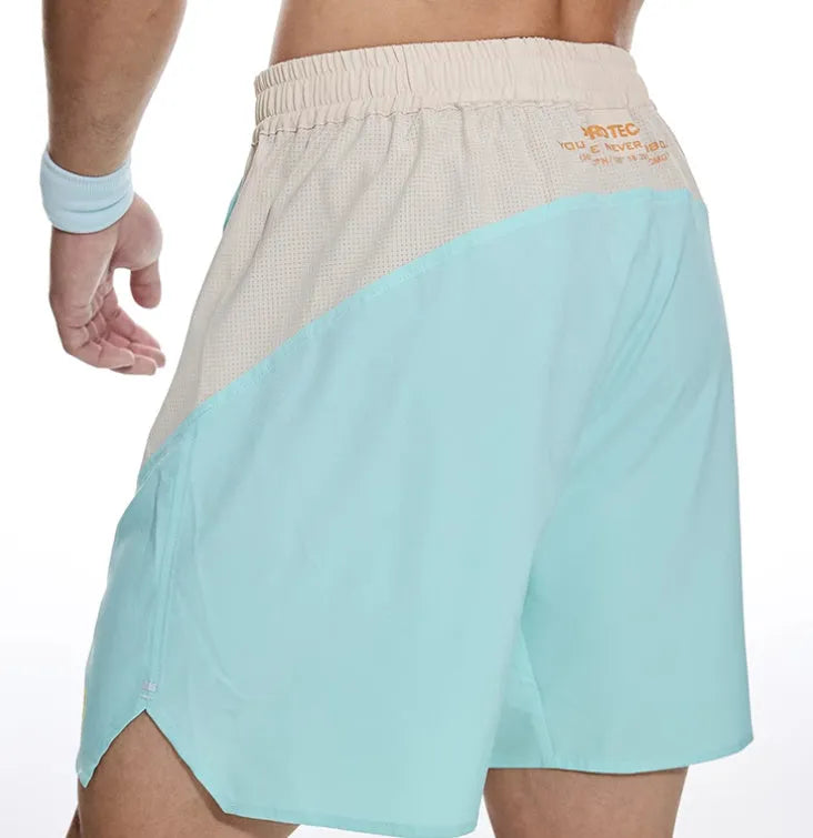 Men's loose grey workout shorts with elastic waist and lace-up closure for gym training