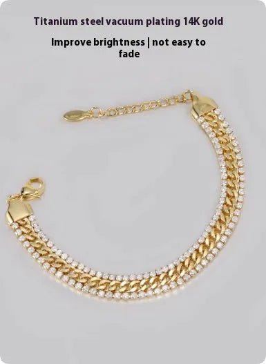 Gold-coloured unisex tennis bracelet made from titanium steel with inlaid artificial gemstones.