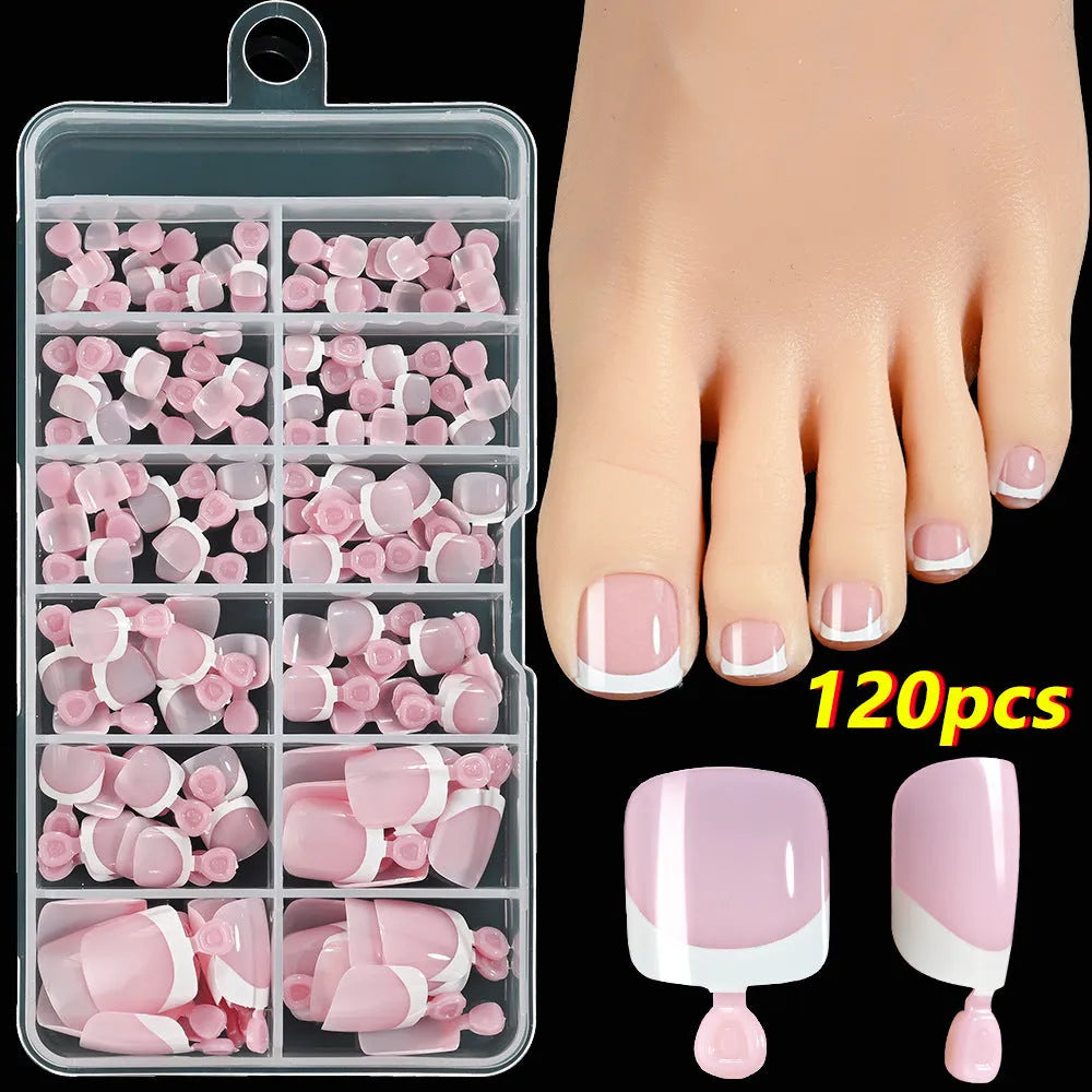 120 piece box of square short French style artificial toe nails with white tips on nude base.