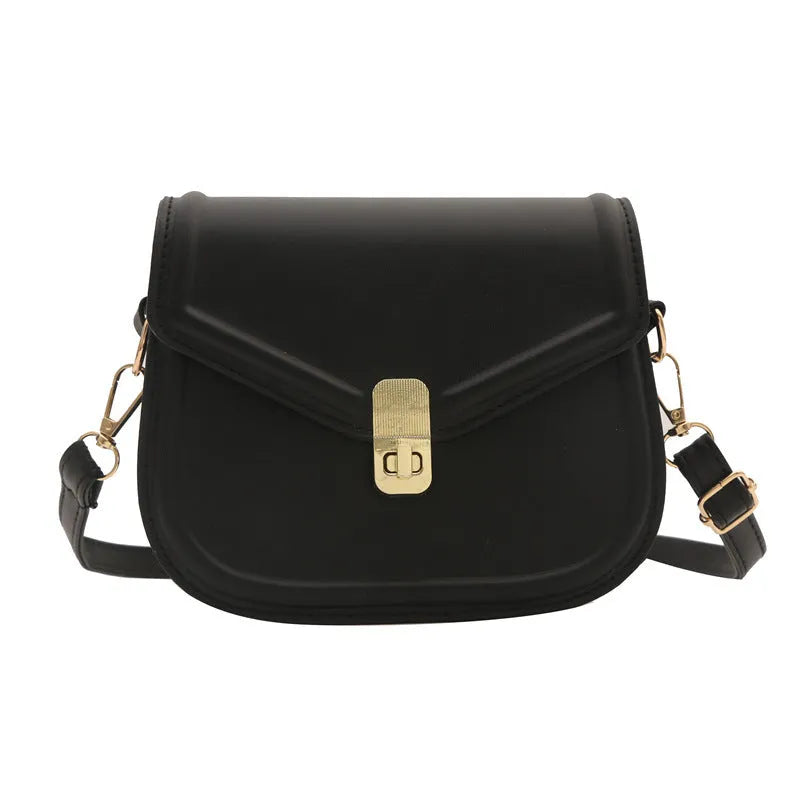 Soft textured PU leather messenger bag with clamshell opening in dark brown colour