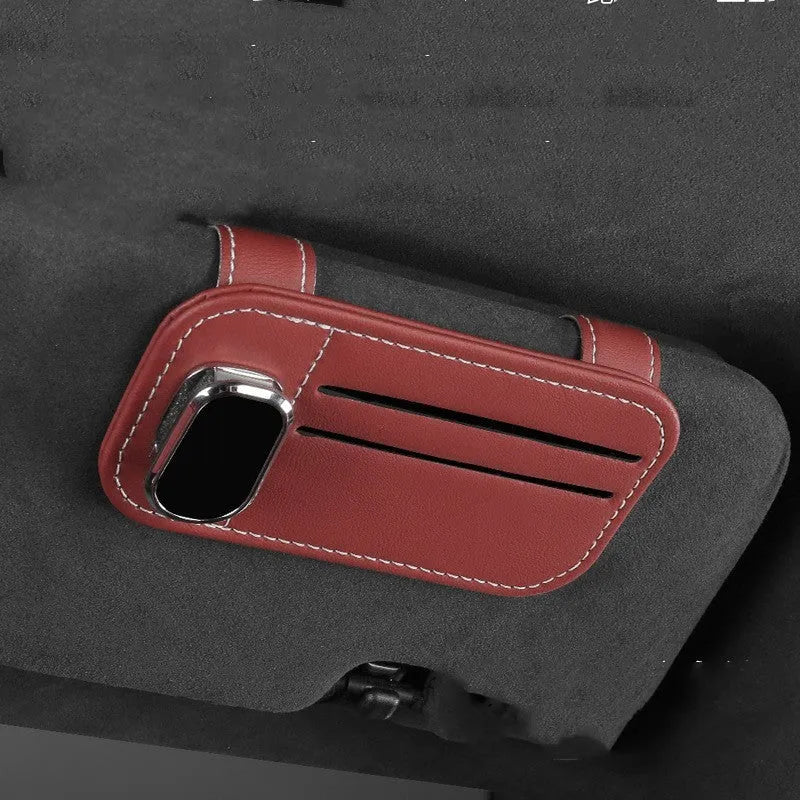 Beige cowhide leather automotive sun visor card holder with a glasses clip attached.