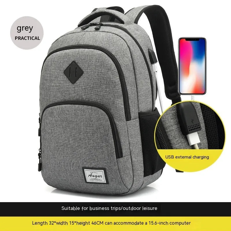 Grey lightweight nylon backpack with USB charging port shown on a trolley suitcase.
