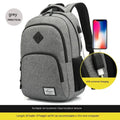 Grey lightweight nylon backpack with USB charging port shown on a trolley suitcase.