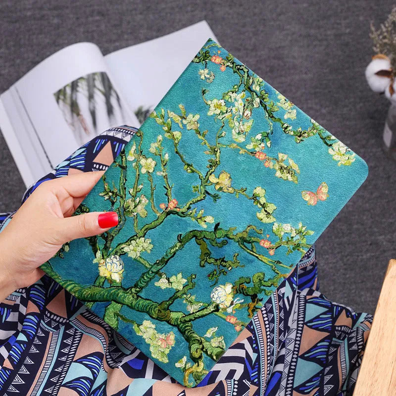 Handmade liquid silicone iPad flip case with floral design, shown open next to an iPad.