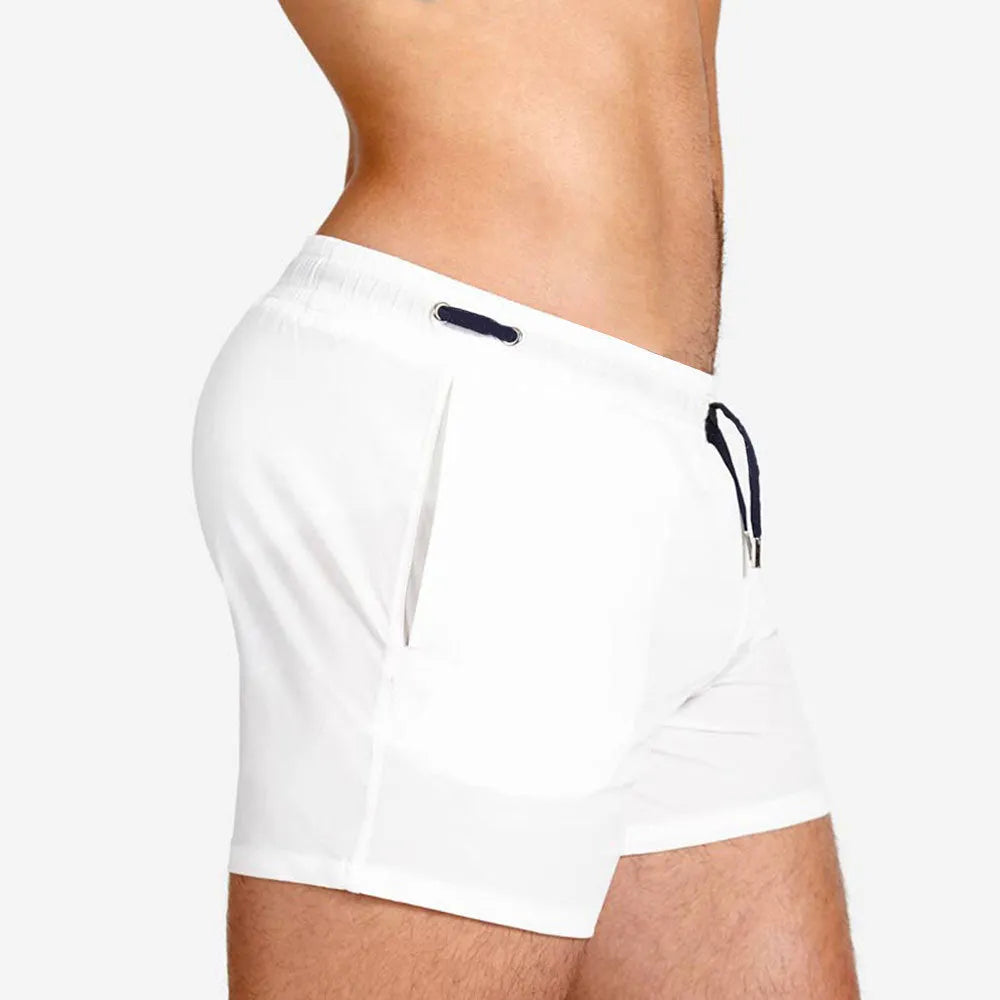 Men's solid colour swimming shorts with mesh lining for sports and fitness in Army Green.