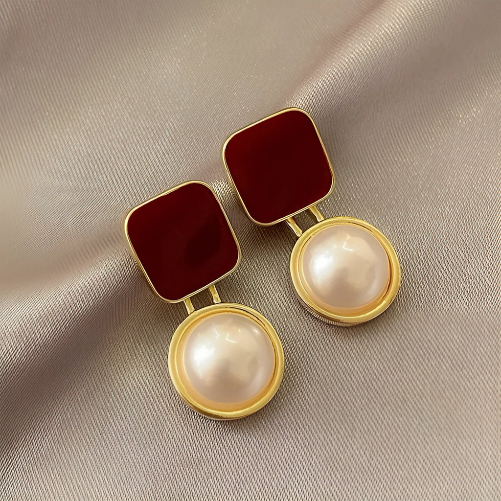 Red and blue geometric alloy stud earrings with pearl detail and quadrilateral shape, one pair