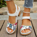 White women's high heel sandals with a velcro buckle strap and rubber sole.