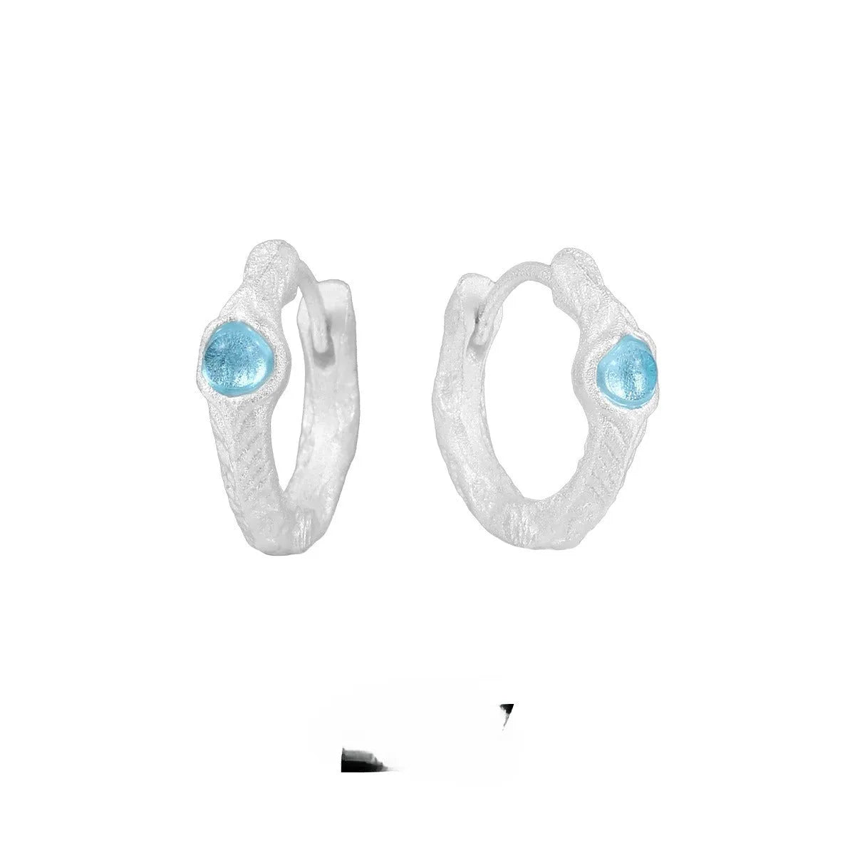 Geometric burnt silver ear clip for women, made from 925 sterling silver with a round design element.