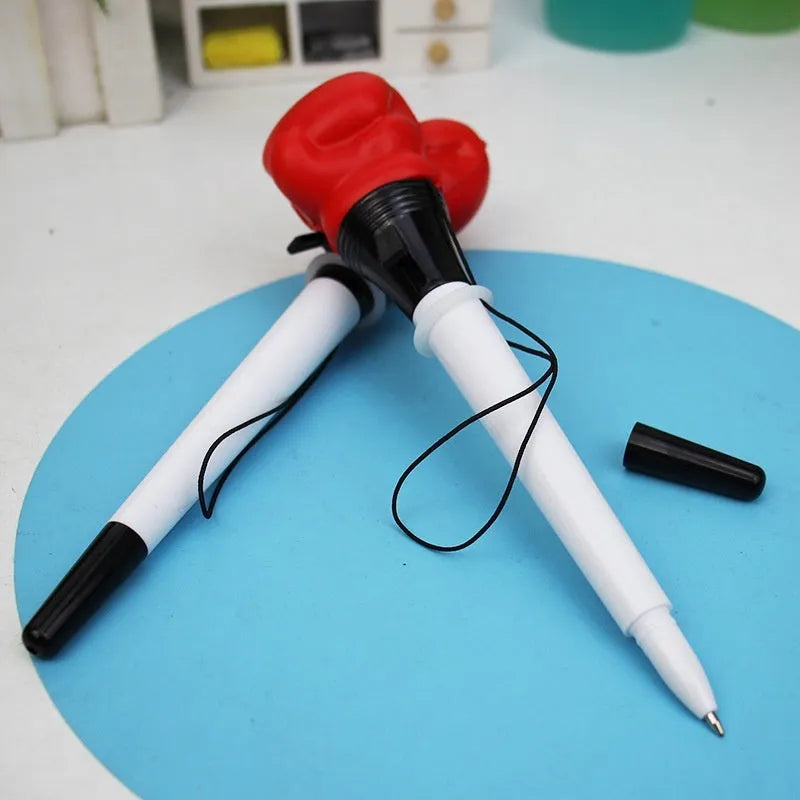 Four boxing press ejection pens showing push-button fidget mechanism and 0.7mm writing tips