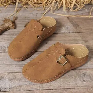 Women's lightweight wedge slippers in various colours with cloth upper and rubber sole.