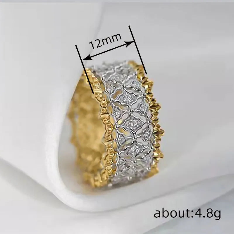 Geometric two-tone zircon ring in gold and silver on copper, showing round stone and available in sizes 6-10.