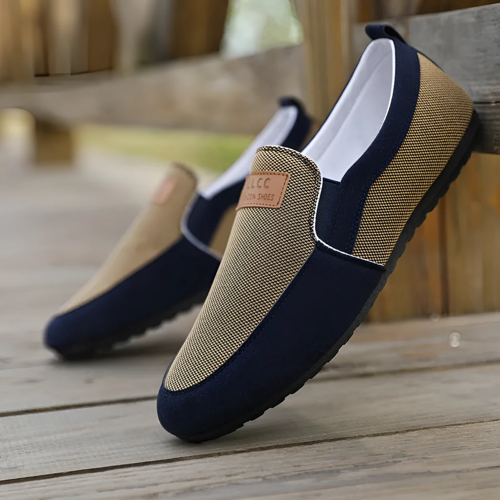 Men's grey canvas board shoes with round toe and sewing thread detail on cotton-lined upper